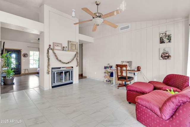 living room with wooden walls and lofted ceiling