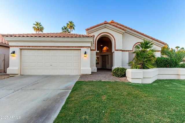 mediterranean / spanish home featuring concrete driveway, a garage, a front lawn, stucco siding, and a tile roof