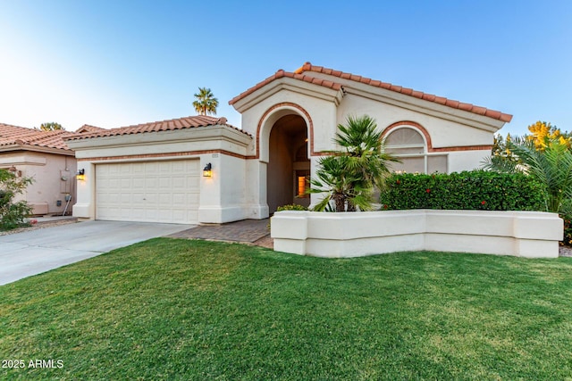 mediterranean / spanish house featuring an attached garage, concrete driveway, a front yard, a tiled roof, and stucco siding