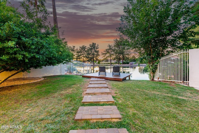 view of yard featuring a deck with water view
