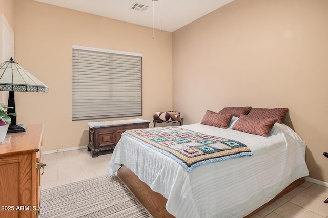 bedroom with light tile patterned floors