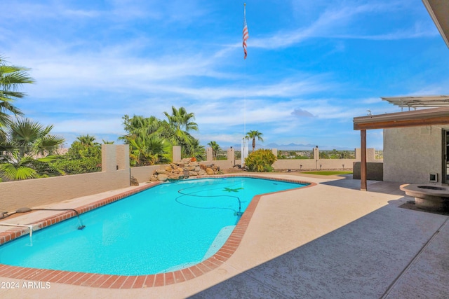 outdoor pool featuring a fenced backyard and a patio