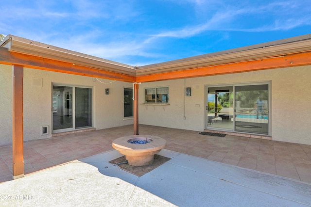 view of patio / terrace with an outdoor fire pit