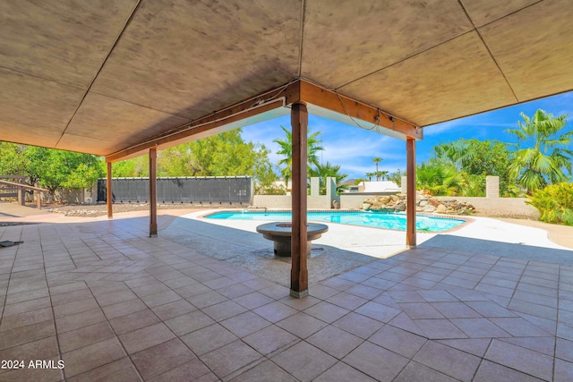 view of pool featuring a patio area, a fenced in pool, and a fenced backyard