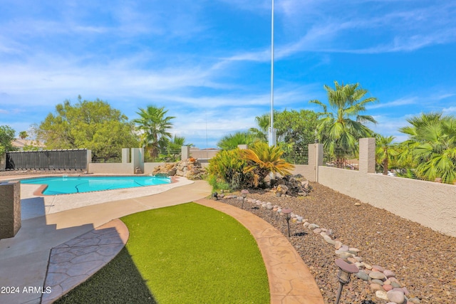 view of pool with a patio area, a fenced in pool, and a fenced backyard