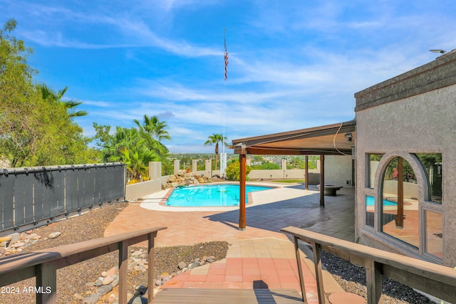 view of pool featuring a patio area