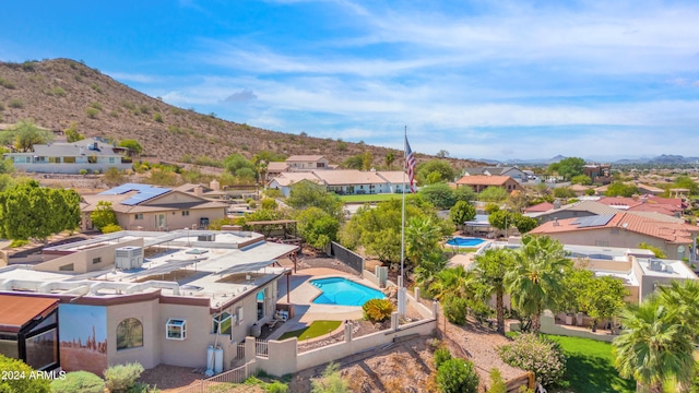 birds eye view of property with a mountain view