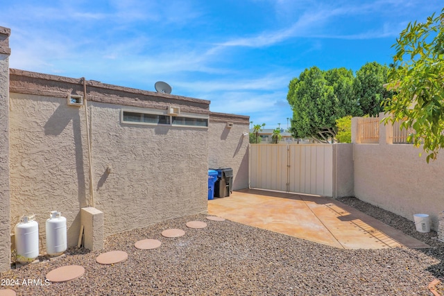 exterior space with fence and a gate