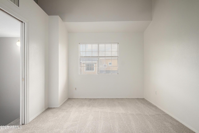 spare room with light carpet and visible vents