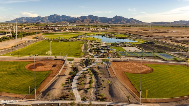 drone / aerial view featuring a water and mountain view