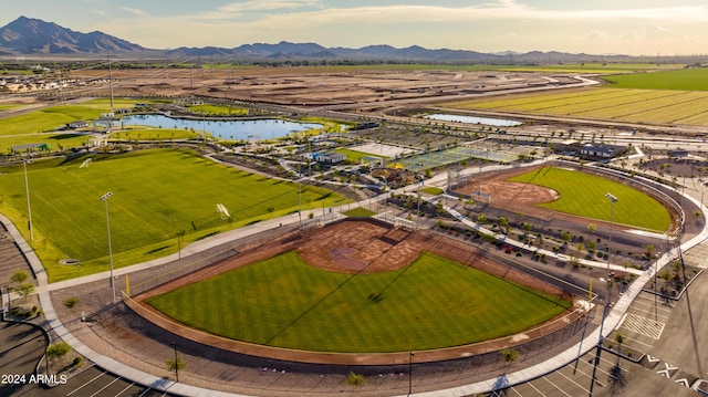 drone / aerial view with a water and mountain view