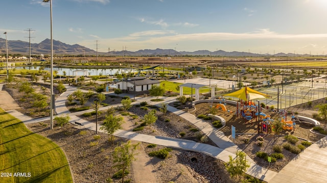 birds eye view of property featuring a water and mountain view