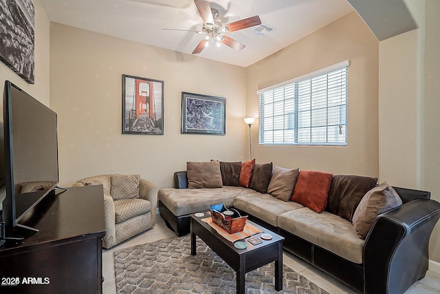 living area with ceiling fan