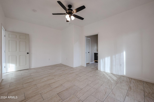 unfurnished room with ceiling fan