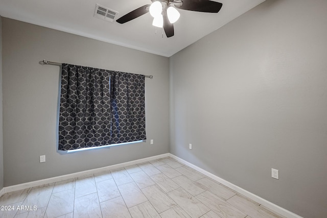 spare room with ceiling fan and lofted ceiling