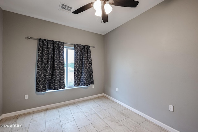 spare room with ceiling fan and lofted ceiling