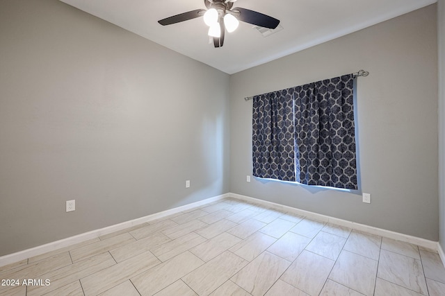 spare room featuring ceiling fan