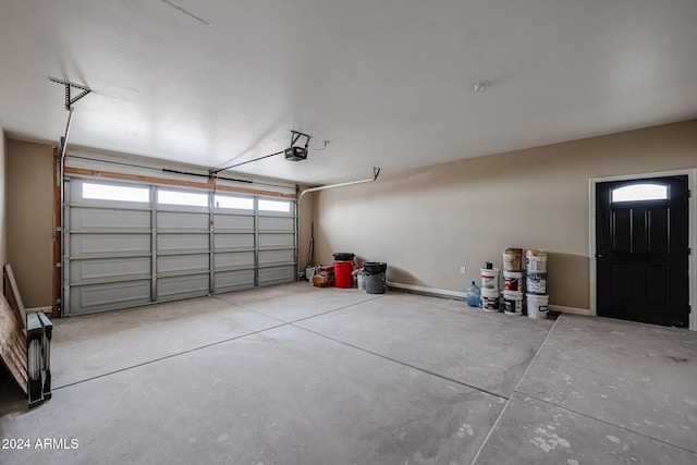 garage featuring a garage door opener