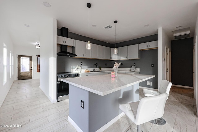 kitchen featuring electric range, a center island, gray cabinetry, and sink