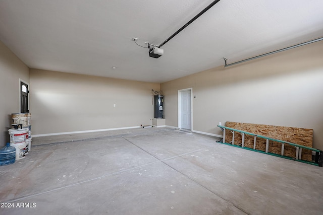 garage featuring electric water heater and a garage door opener