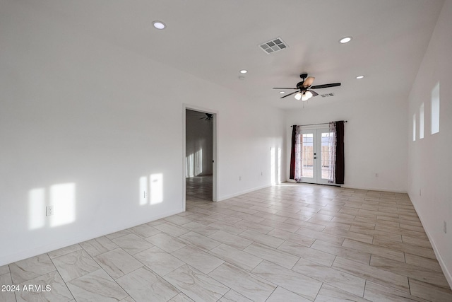 unfurnished room with french doors and ceiling fan