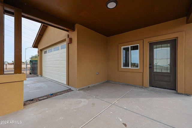 doorway to property featuring a garage