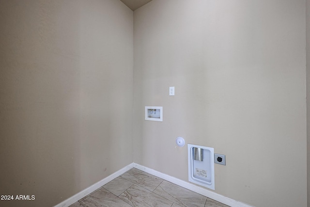 clothes washing area featuring electric dryer hookup, gas dryer hookup, and washer hookup