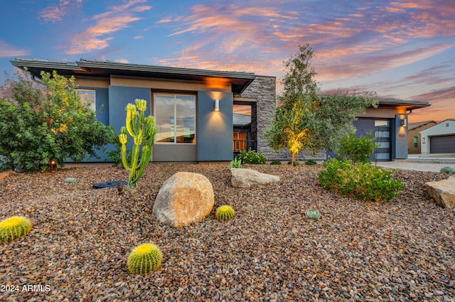 prairie-style house featuring a garage