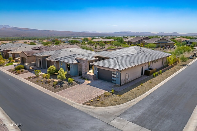 birds eye view of property featuring a mountain view