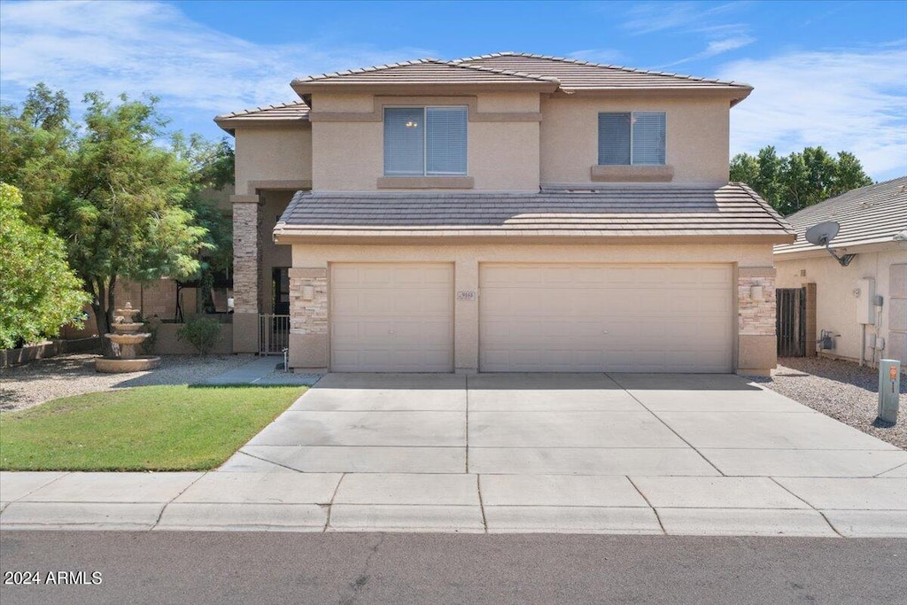 front of property with a garage