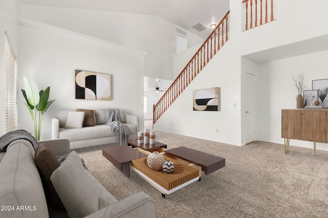 living room with ceiling fan, carpet floors, and high vaulted ceiling