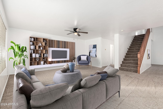 carpeted living room with ceiling fan