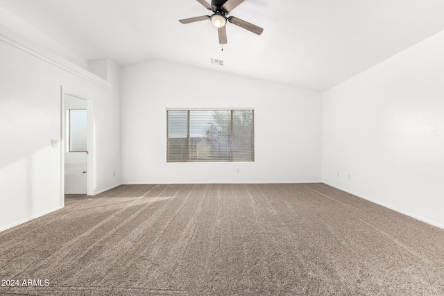 carpeted empty room featuring ceiling fan and lofted ceiling