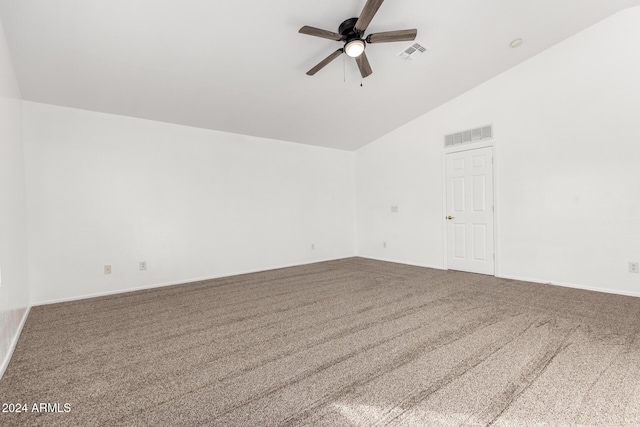 empty room with carpet flooring, ceiling fan, and high vaulted ceiling