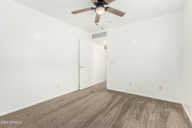 spare room featuring carpet flooring and ceiling fan