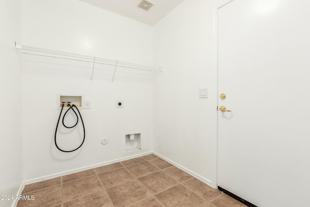 clothes washing area with hookup for an electric dryer, washer hookup, and gas dryer hookup