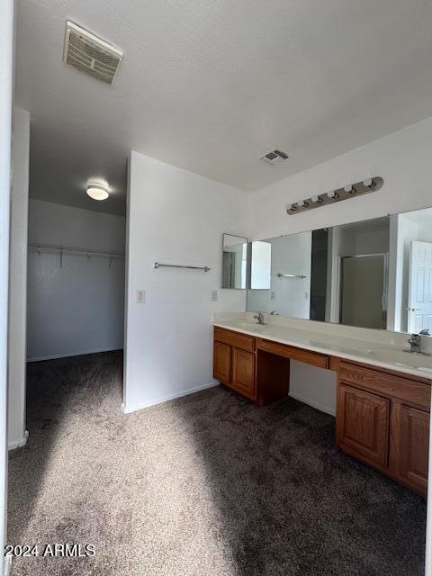 bathroom with vanity and an enclosed shower