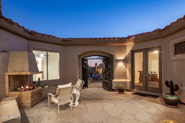 view of patio featuring a multi sided fireplace