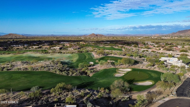 drone / aerial view with a mountain view and golf course view