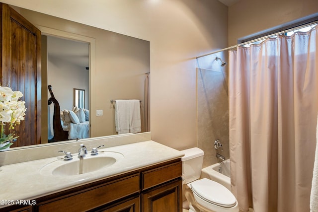 bathroom with vanity, toilet, and shower / bath combo with shower curtain