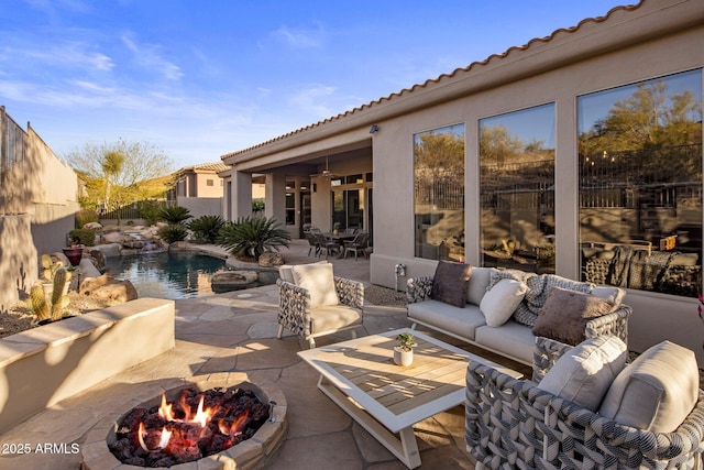 view of patio featuring an outdoor living space with a fire pit, outdoor dining area, and a fenced backyard