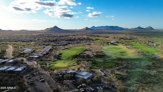 aerial view with golf course view and a mountain view