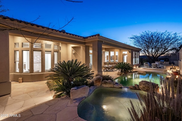 view of swimming pool featuring a patio area and a pool with connected hot tub