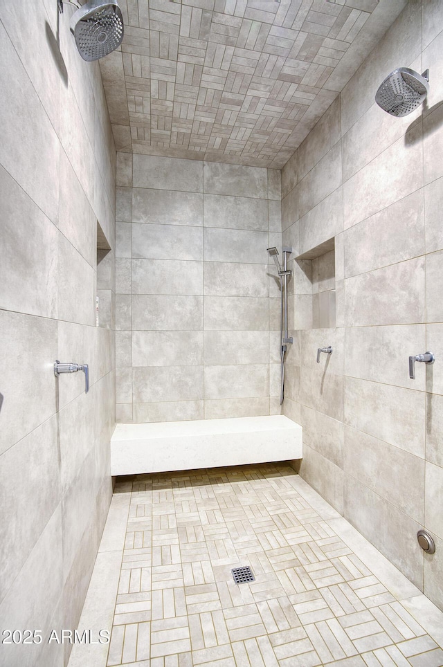 bathroom with a tile shower