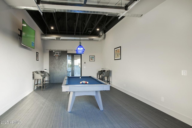 game room with carpet floors, billiards, baseboards, and a high ceiling