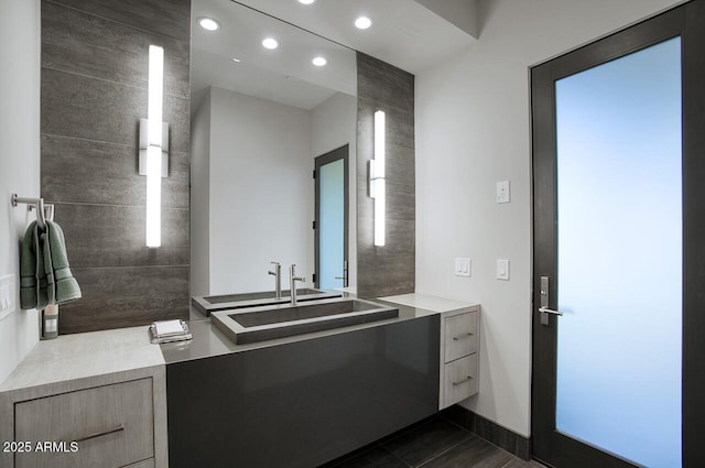 bathroom with recessed lighting, tile patterned flooring, and vanity