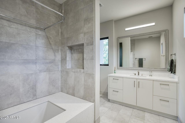 full bath with vanity and a shower