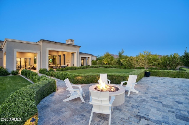 view of patio / terrace with a fire pit