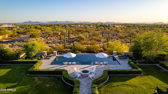 drone / aerial view featuring a mountain view