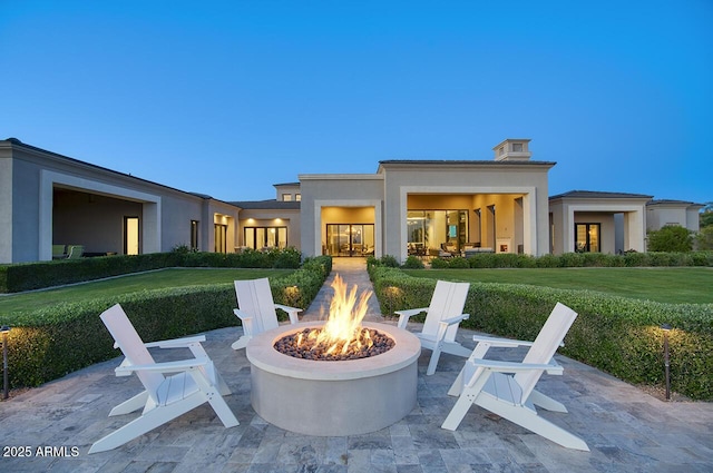 view of patio featuring an outdoor fire pit